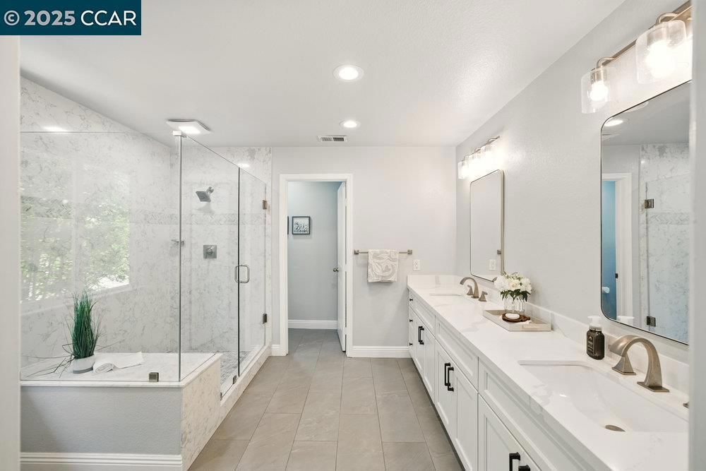 Bathroom, Dual Sink Vanities, Glass Shower, Interior, Marble Walls, Recessed Lighting