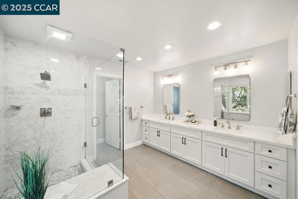 Bathroom, Dual Sink Vanities, Glass Shower, Interior, Marble Walls, Recessed Lighting