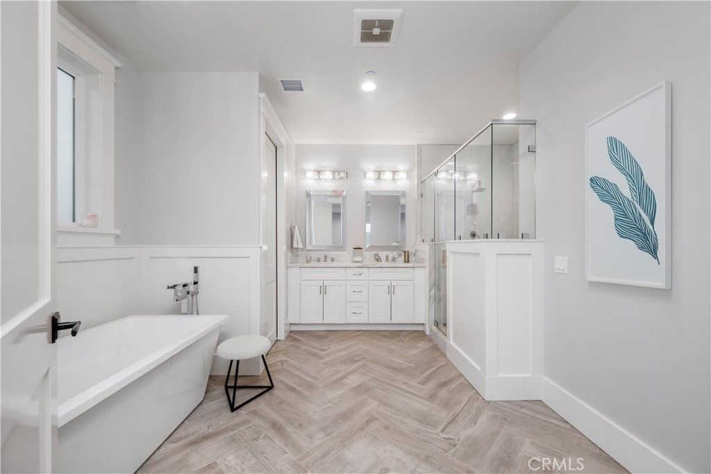 Bathroom, Dual Sink Vanities, Free Standing Baths, Glass Shower, Interior, Recessed Lighting, Wood Texture Flooring