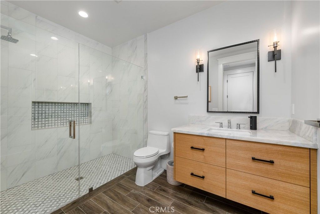 Bathroom, Glass Shower, Interior, Marble Walls, Recessed Lighting, Wood Texture Flooring