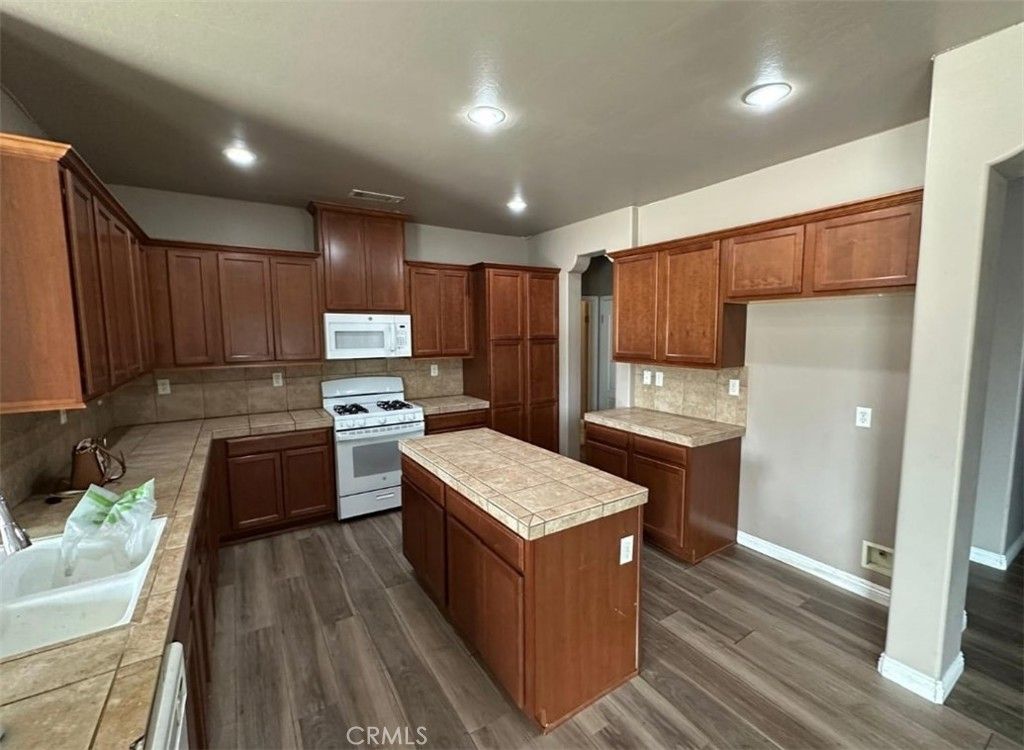 Interior, Kitchen, Recessed Lighting, Tile Countertops, Wood Texture Flooring
