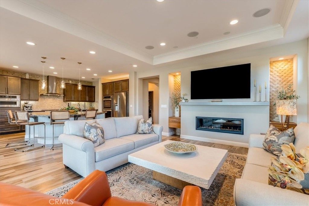 Dining room, Fireplace, Interior, Kitchen, Living room, Pendant Lights, Recessed Lighting, Stainless Steel Appliances, Wood Texture Flooring