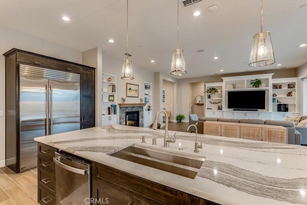 Fireplace, Interior, Kitchen, Pendant Lights, Recessed Lighting, Stainless Steel Appliances, Wood Texture Flooring