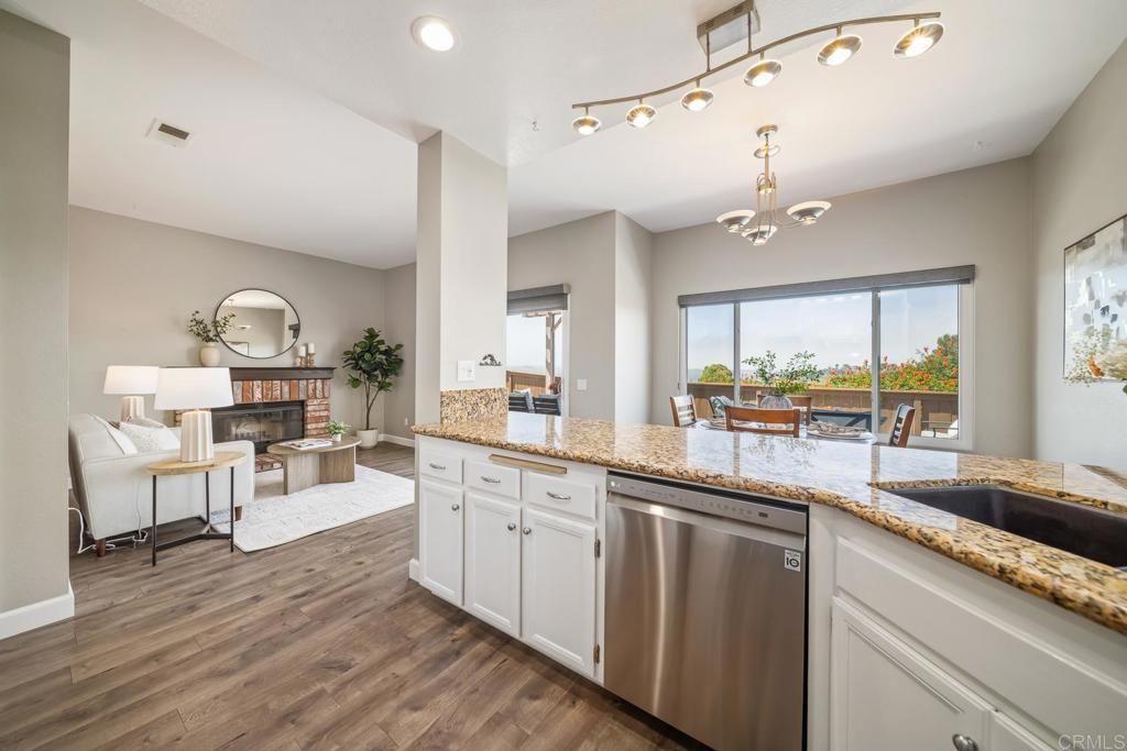 Chandelier, Fireplace, Interior, Kitchen, Living room, Recessed Lighting, Wood Texture Flooring