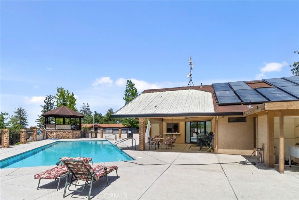 Exterior, Pool, Solar Panels