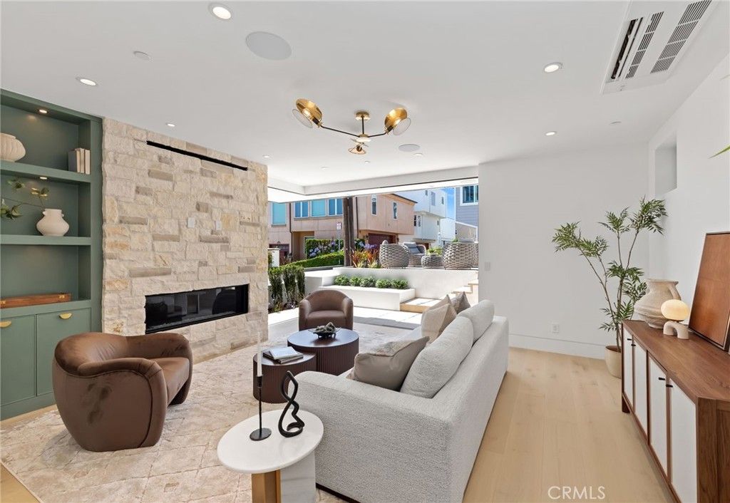Fireplace, Interior, Living room, Recessed Lighting, Stone Walls, Wood Texture Flooring