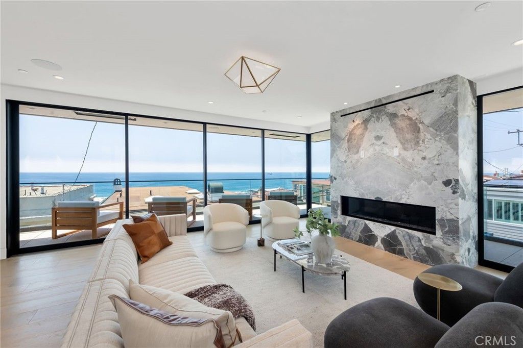 Fireplace, Interior, Living room, Marble Walls, Recessed Lighting, Water, Wood Texture Flooring