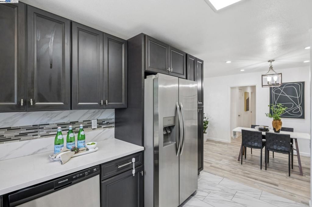 Dining room, Interior, Kitchen, Marble, Pendant Lights, Recessed Lighting, Stainless Steel Appliances, Wood Texture Flooring
