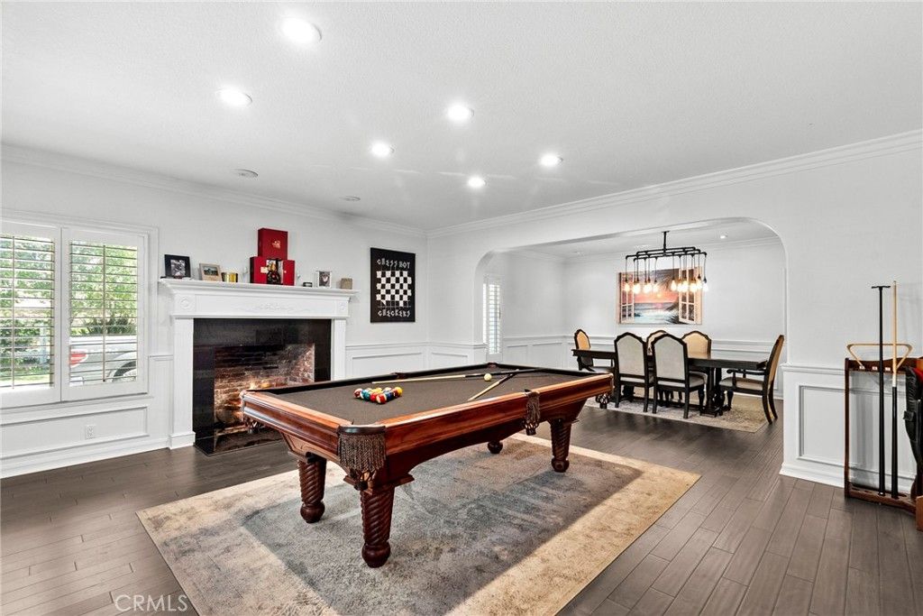 Billiard Table, Chandelier, Dining room, Fireplace, Game Room, Interior, Pendant Lights, Recessed Lighting, Wood Texture Flooring