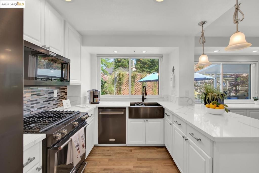 Interior, Kitchen, Pendant Lights, Recessed Lighting, Stainless Steel Appliances, Wood Texture Flooring