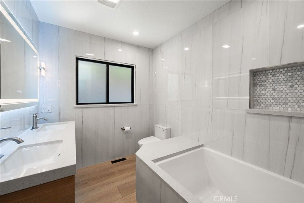 Bathroom, Dual Sink Vanities, Interior, Recessed Lighting, Wood Texture Flooring