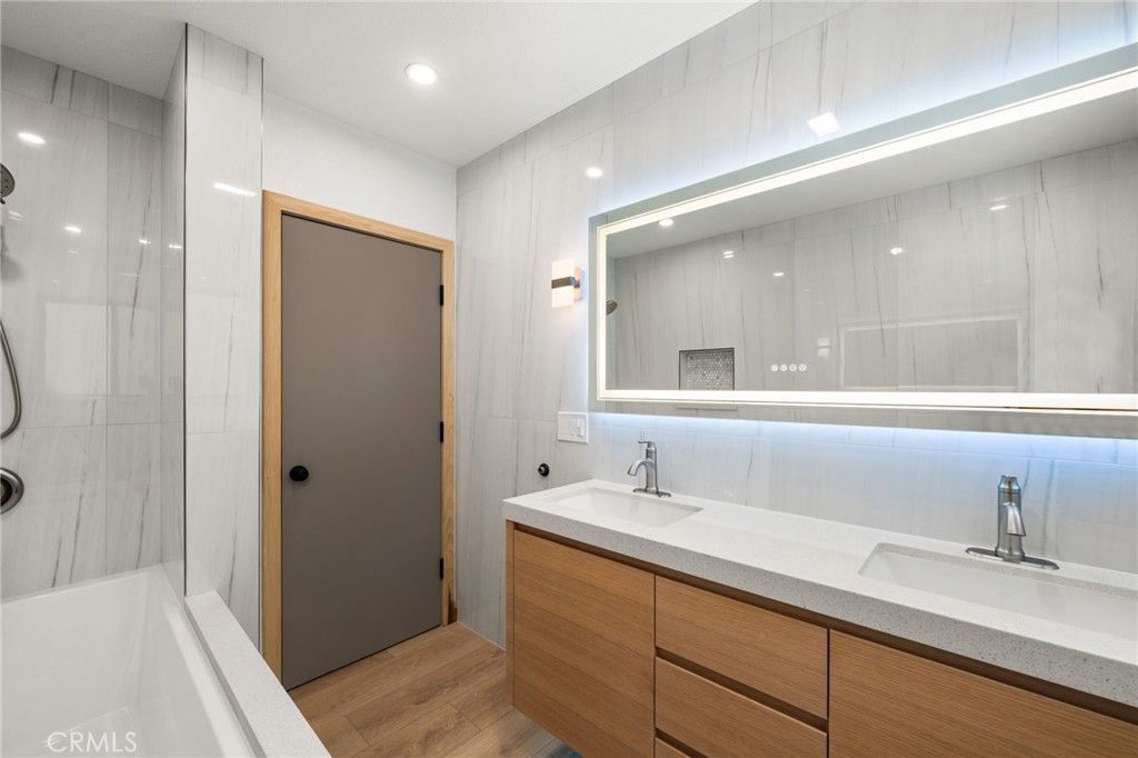 Bathroom, Dual Sink Vanities, Glass Shower, Interior, Recessed Lighting, Wood Texture Flooring