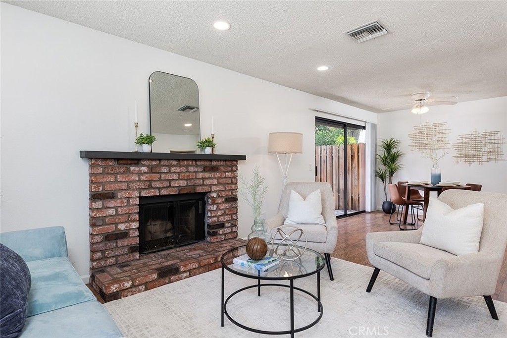 Dining room, Fireplace, Interior, Living room, Recessed Lighting, Wood Texture Flooring