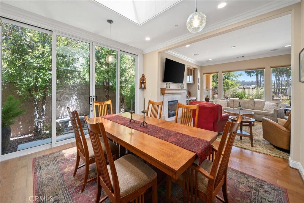 Dining room, Fireplace, Interior, Living room, Pendant Lights, Recessed Lighting, Wood Texture Flooring