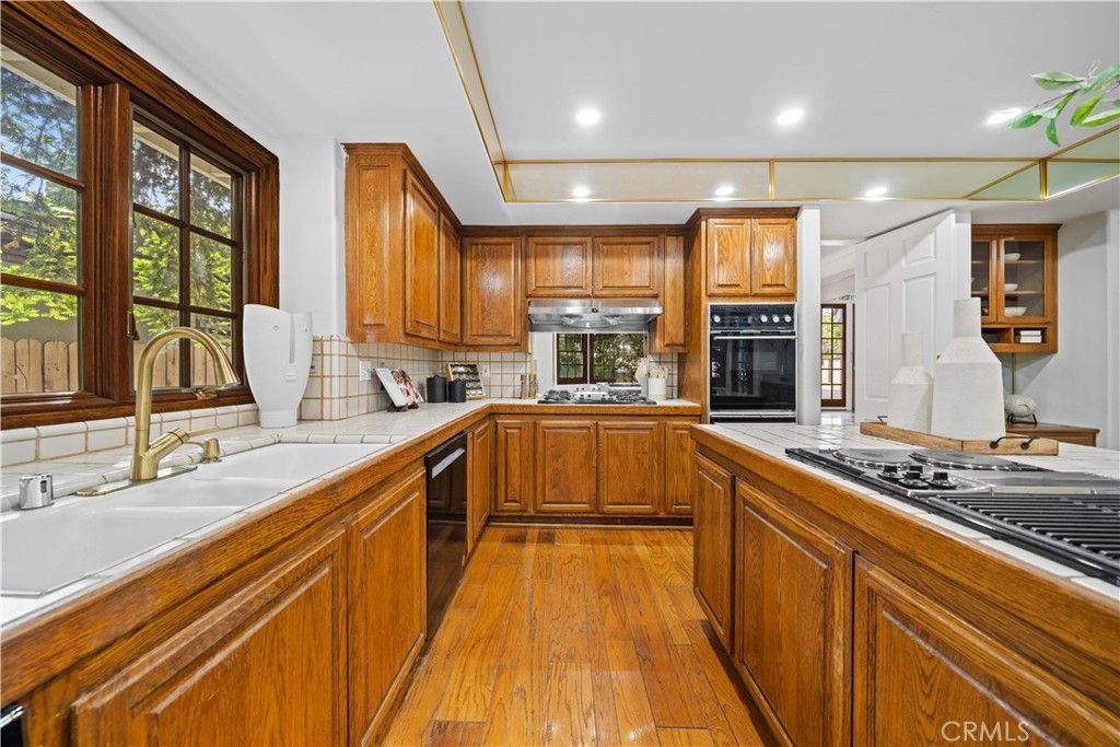 Interior, Kitchen, Recessed Lighting, Tile Countertops, Wood Texture Flooring