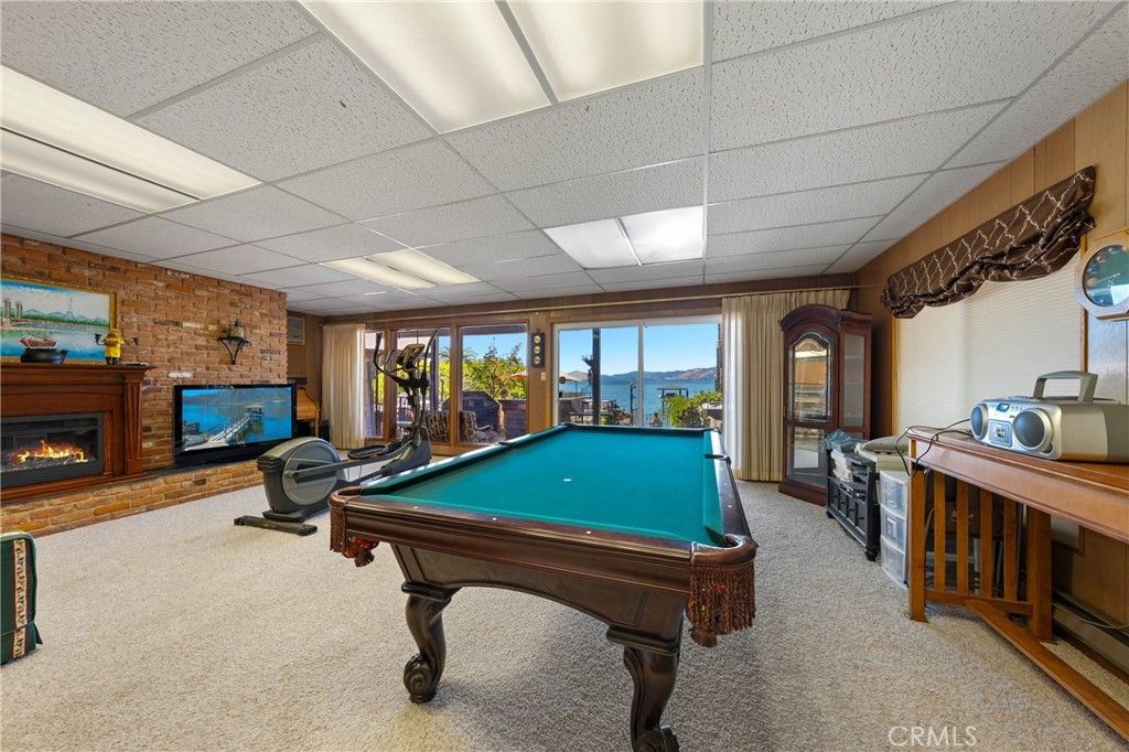 Billiard Table, Fireplace, Fitness Equipment, Game Room, Interior, Recessed Lighting, Stone Walls