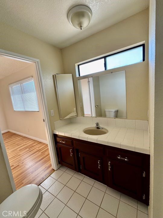 Bathroom, Dual Sink Vanities, Interior, Tile Countertops, Wood Texture Flooring