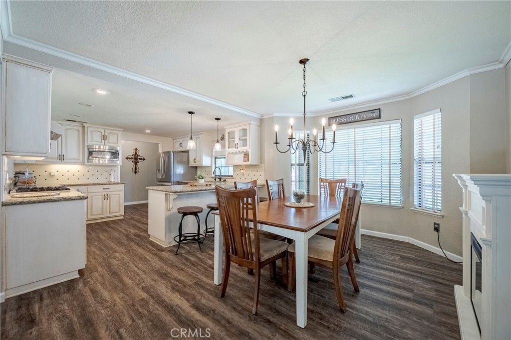Chandelier, Dining room, Fireplace, Interior, Kitchen, Pendant Lights, Recessed Lighting, Wood Texture Flooring
