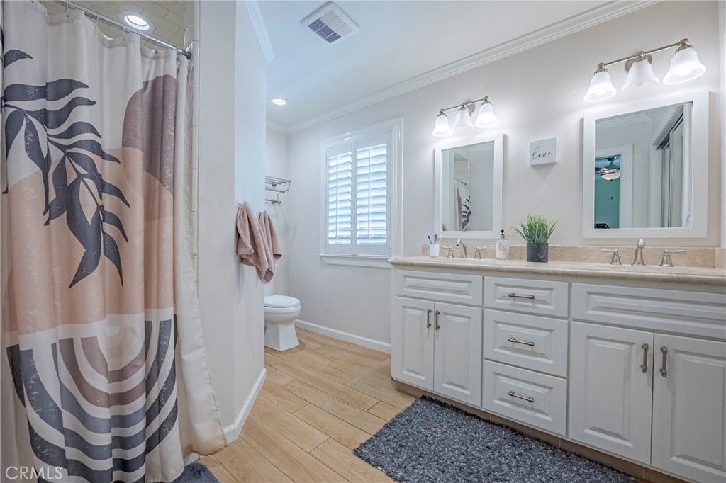 Bathroom, Dual Sink Vanities, Interior, Recessed Lighting, Wood Texture Flooring