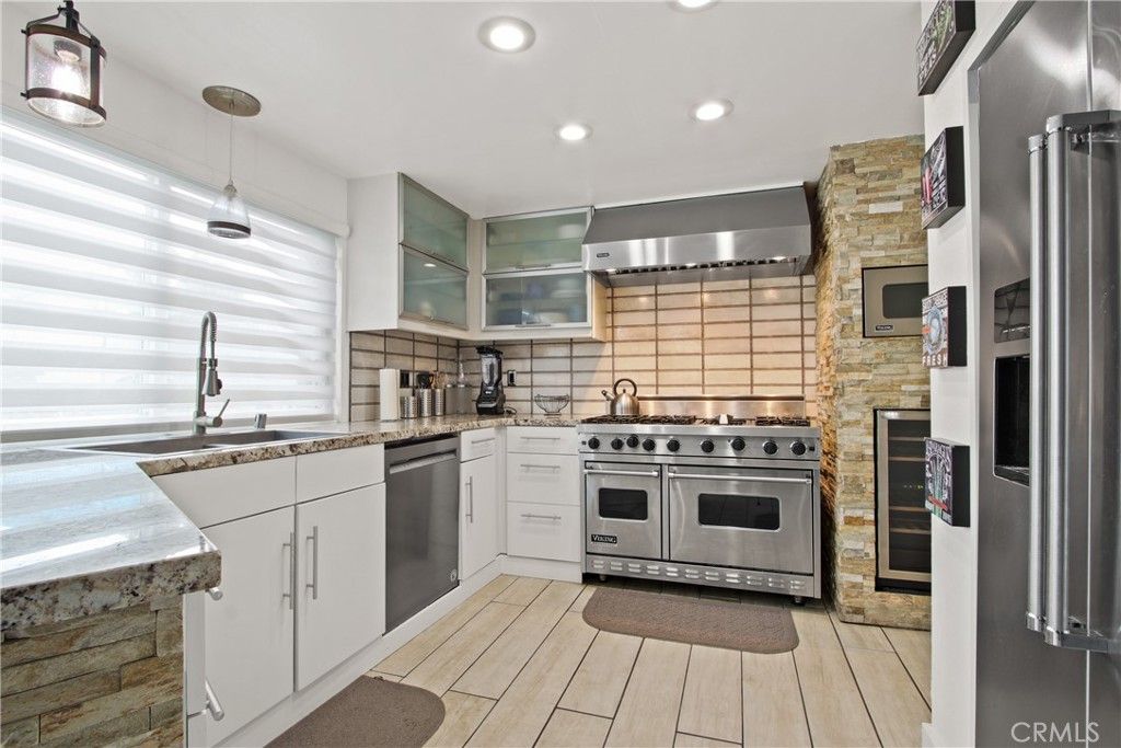 Interior, Kitchen, Pendant Lights, Recessed Lighting, Stainless Steel Appliances, Stone Walls, Wood Texture Flooring