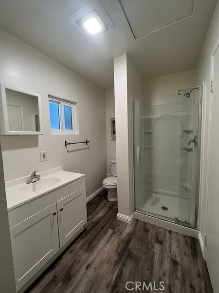 Bathroom, Dual Sink Vanities, Glass Shower, Interior, Recessed Lighting, Wood Texture Flooring