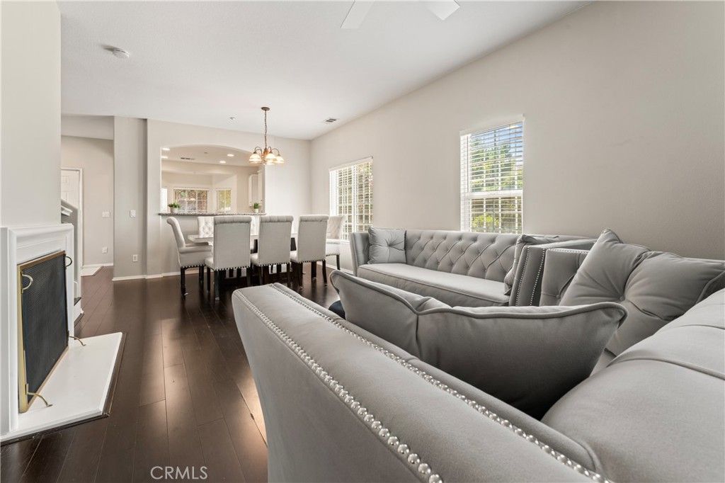 Chandelier, Dining room, Fireplace, Interior, Living room, Pendant Lights, Recessed Lighting, Wood Texture Flooring