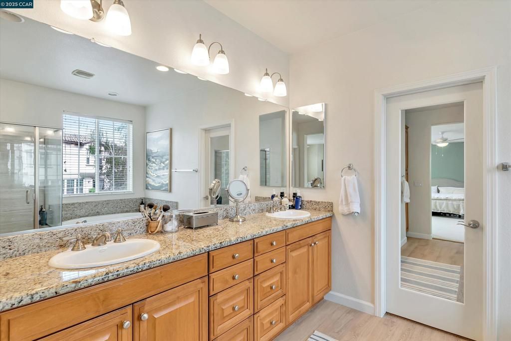 Bathroom, Bedroom, Dual Sink Vanities, Glass Shower, Interior, Wood Texture Flooring