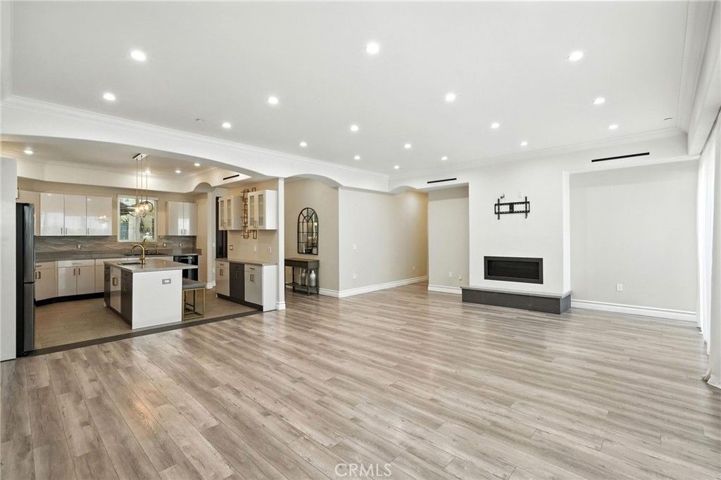 Empty room, Fireplace, Interior, Kitchen, Pendant Lights, Recessed Lighting, Wood Texture Flooring