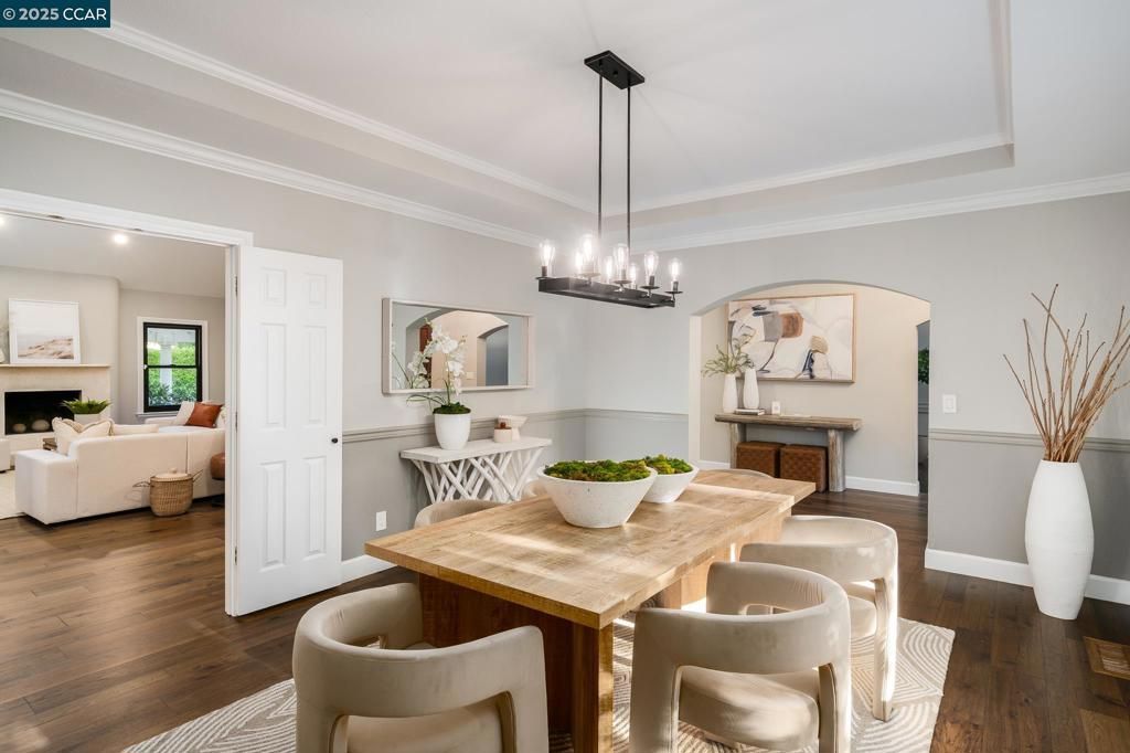 Chandelier, Dining room, Fireplace, Interior, Living room, Pendant Lights, Recessed Lighting, Wood Texture Flooring