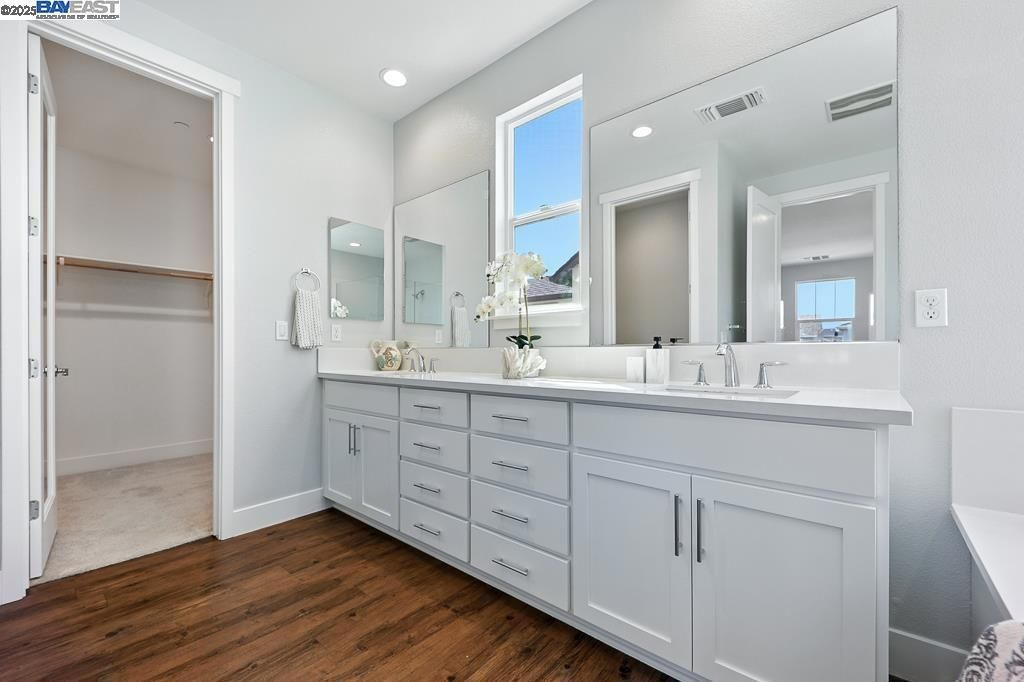 Bathroom, Dual Sink Vanities, Interior, Recessed Lighting, Walk-in Closets, Wood Texture Flooring
