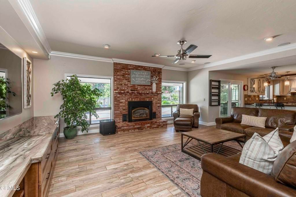 Fireplace, Interior, Living room, Pendant Lights, Recessed Lighting, Stone Walls, Wood Texture Flooring