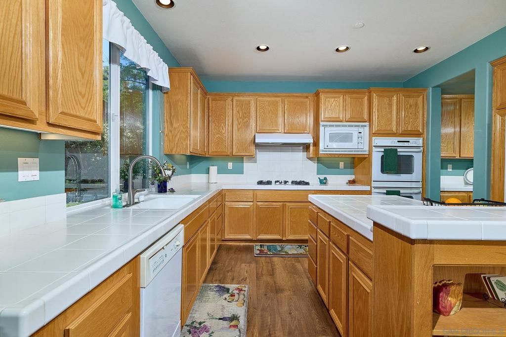 Interior, Kitchen, Recessed Lighting, Tile Countertops, Wood Texture Flooring