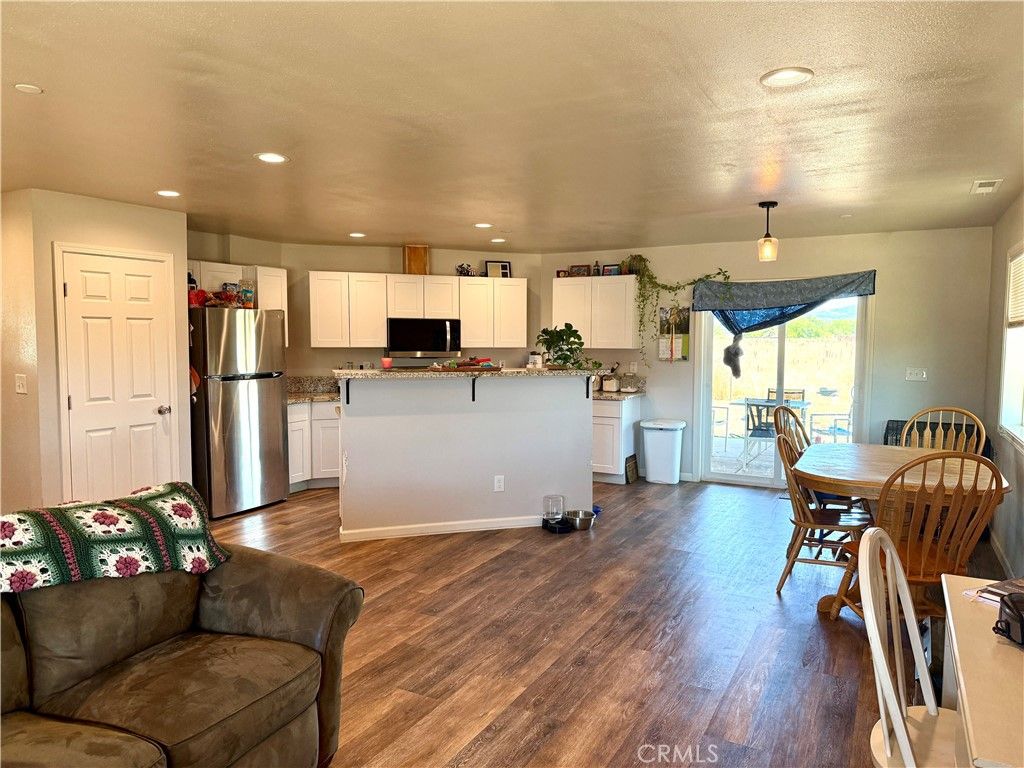 Dining room, Interior, Kitchen, Recessed Lighting, Stainless Steel Appliances, Wood Texture Flooring