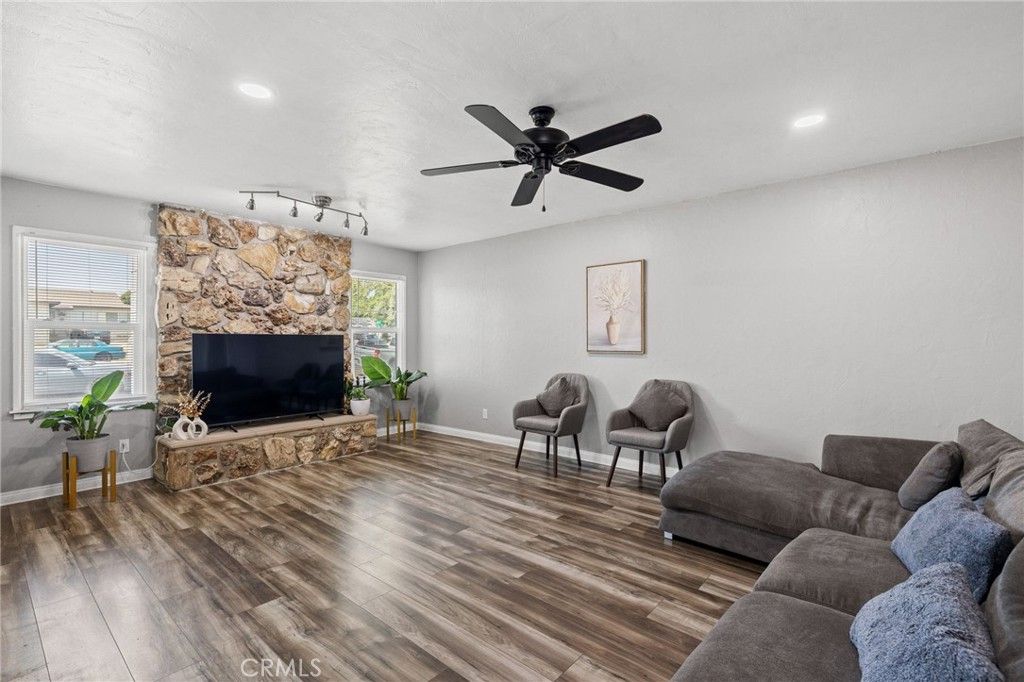 Fireplace, Interior, Living room, Recessed Lighting, Stone Walls, Wood Texture Flooring