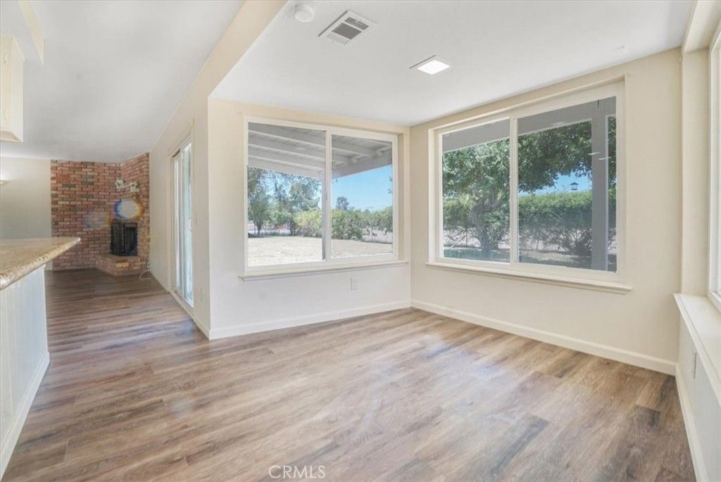 Empty room, Fireplace, Interior, Recessed Lighting, Stone Walls, Wood Texture Flooring