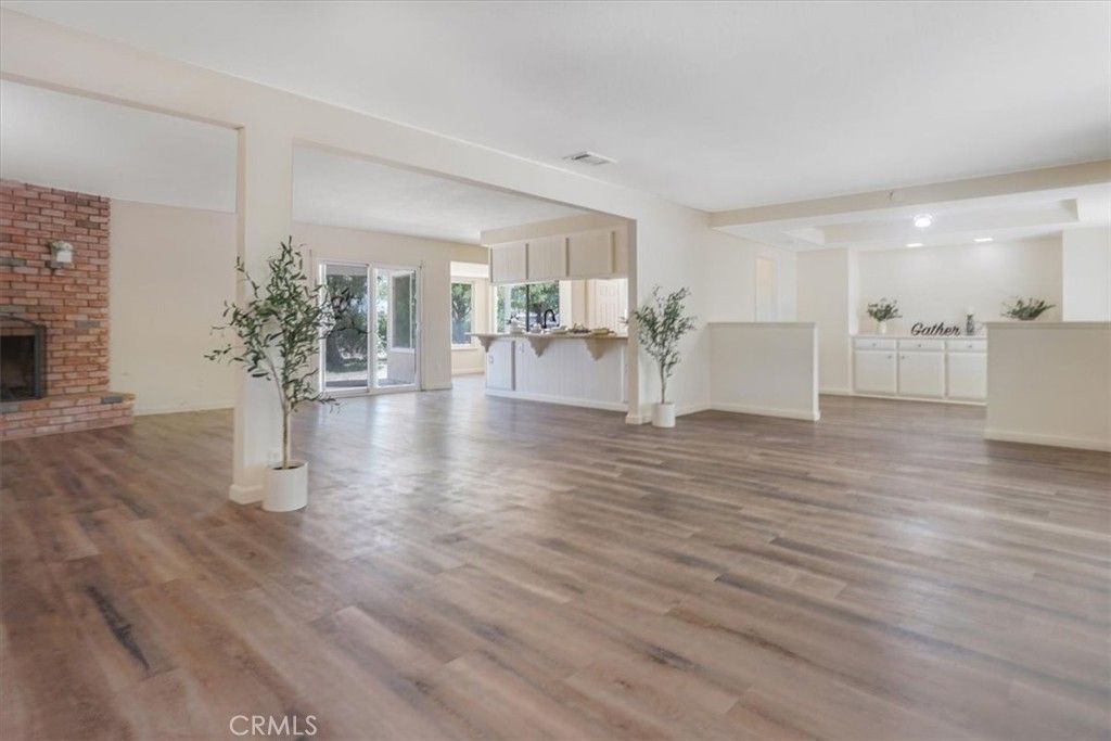 Empty room, Fireplace, Interior, Recessed Lighting, Stone Walls, Wood Texture Flooring