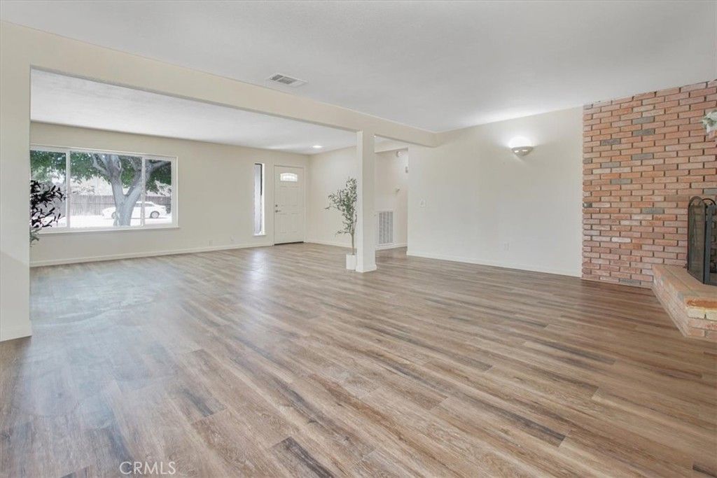 Empty room, Fireplace, Interior, Recessed Lighting, Stone Walls, Wood Texture Flooring