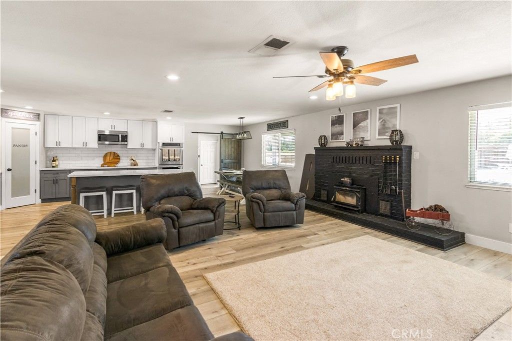 Dining room, Fireplace, Interior, Kitchen, Living room, Pendant Lights, Recessed Lighting, Stainless Steel Appliances, Wood Texture Flooring