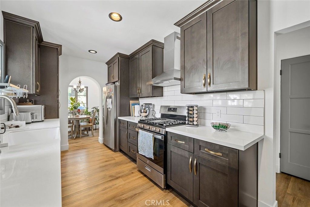 Chandelier, Dining room, Interior, Kitchen, Recessed Lighting, Stainless Steel Appliances, Wood Texture Flooring