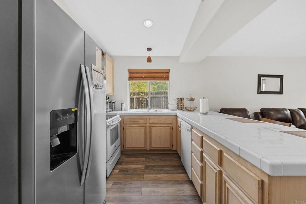 Interior, Kitchen, Recessed Lighting, Tile Countertops, Wood Texture Flooring