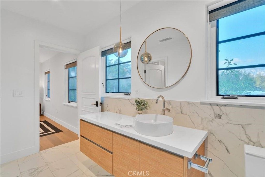 Bathroom, Dual Sink Vanities, Interior, Marble, Marble Walls, Pendant Lights, Wood Texture Flooring