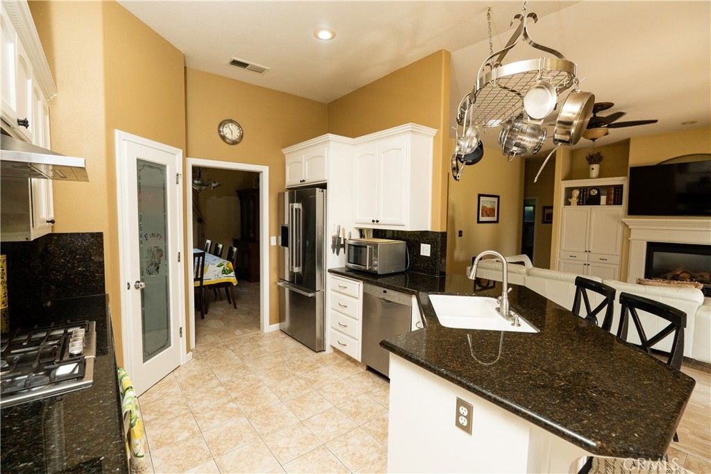 Fireplace, Interior, Kitchen, Pendant Lights, Recessed Lighting, Stainless Steel Appliances