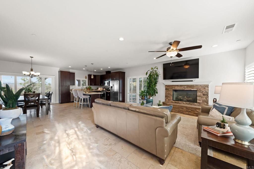 Chandelier, Dining room, Fireplace, Interior, Kitchen, Living room, Recessed Lighting, Stainless Steel Appliances