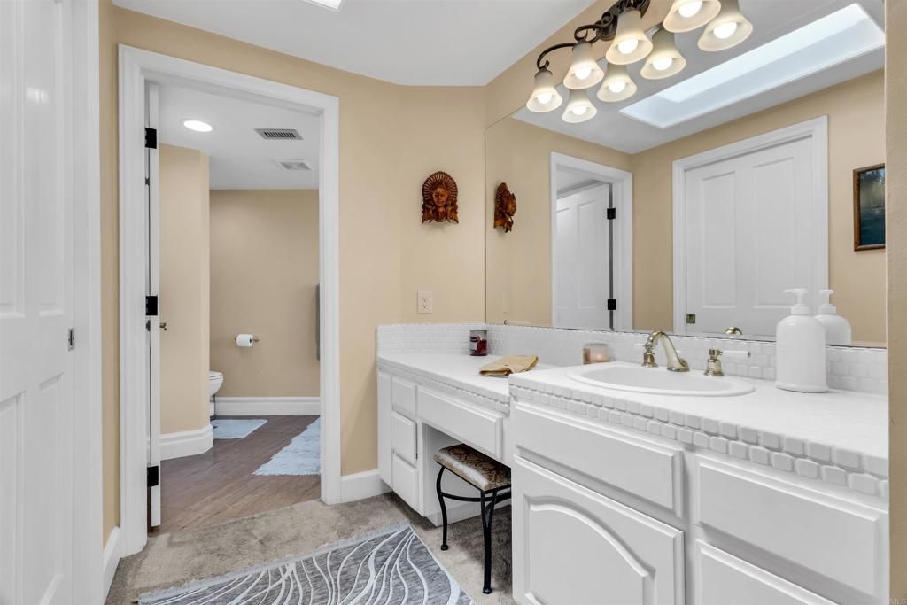 Bathroom, Interior, Recessed Lighting, Tile Countertops, Wood Texture Flooring