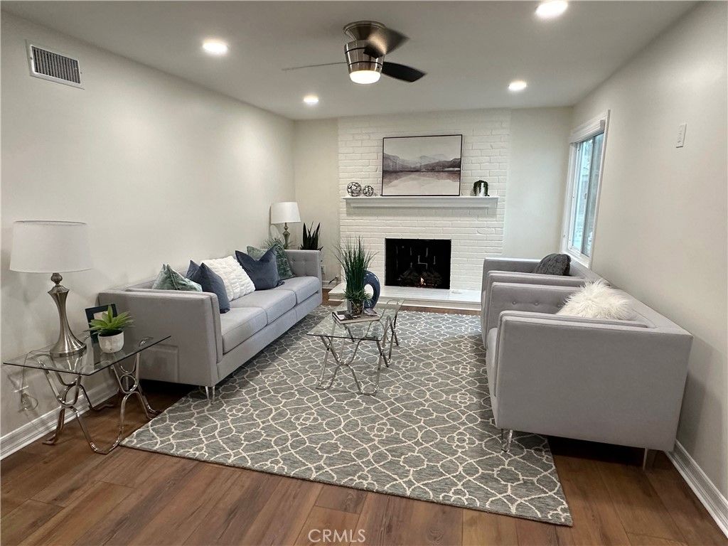 Fireplace, Interior, Living room, Recessed Lighting, Stone Walls, Wood Texture Flooring