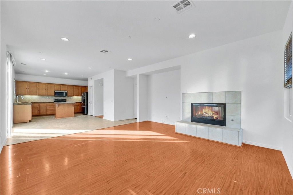 Empty room, Fireplace, Interior, Kitchen, Recessed Lighting, Wood Texture Flooring