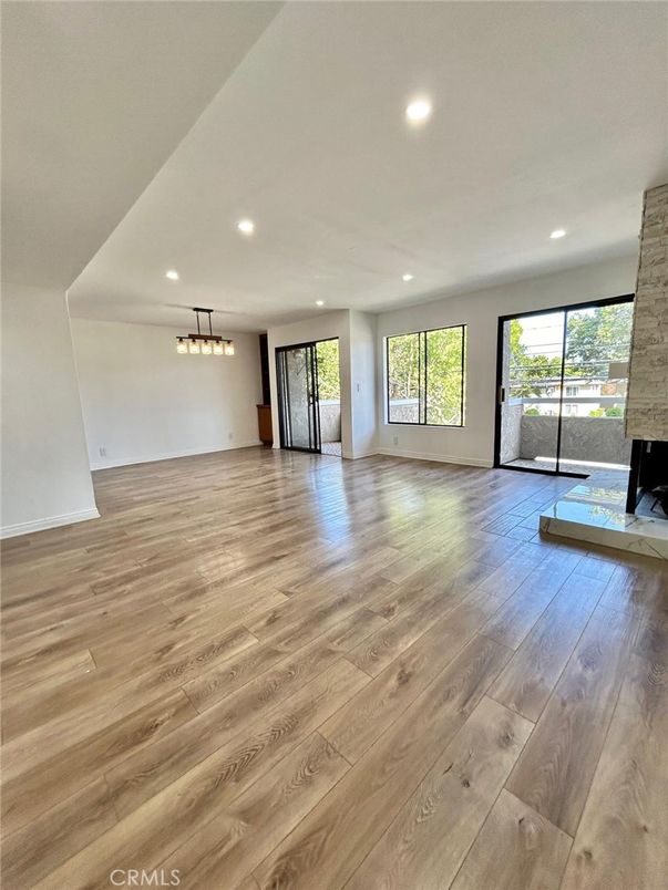 Empty room, Fireplace, Interior, Pendant Lights, Recessed Lighting, Wood Texture Flooring