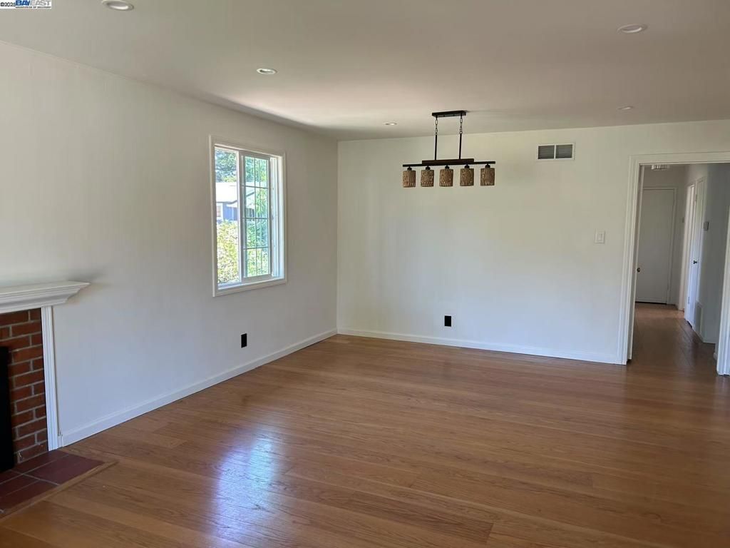 Empty room, Fireplace, Interior, Pendant Lights, Recessed Lighting, Wood Texture Flooring