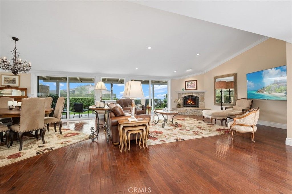 Chandelier, Dining room, Fireplace, Interior, Living room, Recessed Lighting, Wood Texture Flooring