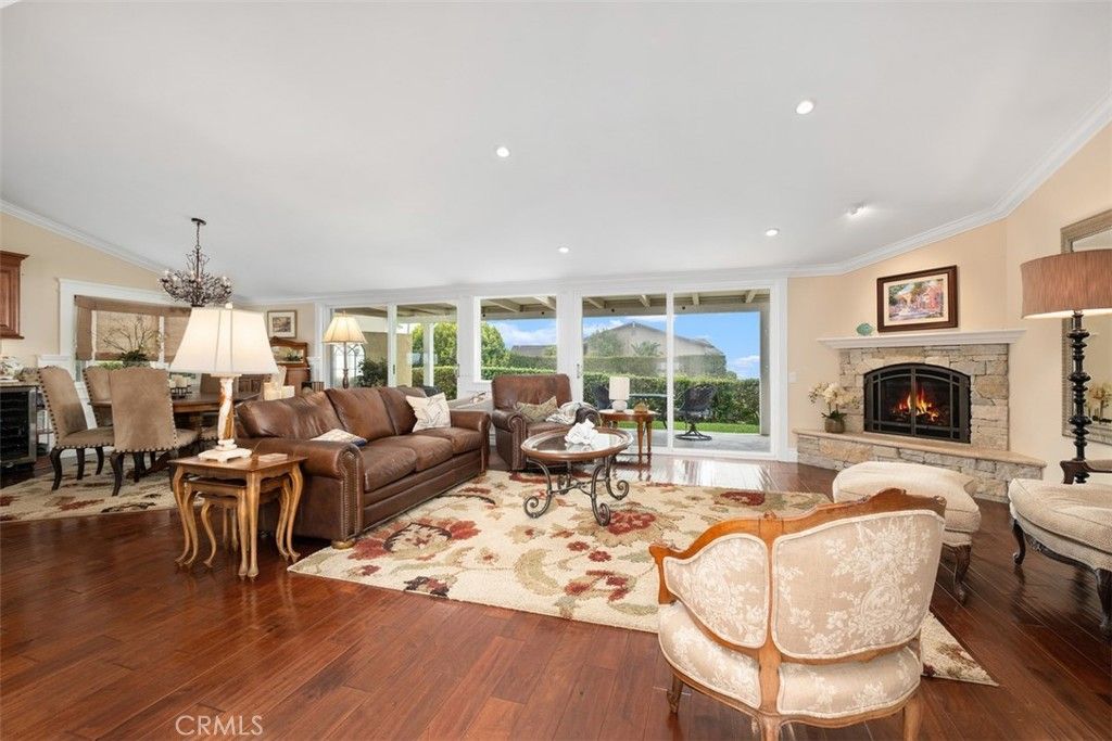 Dining room, Fireplace, Interior, Living room, Recessed Lighting, Wood Texture Flooring